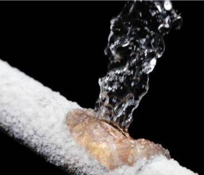 frozen pipe breaking with water rushing out